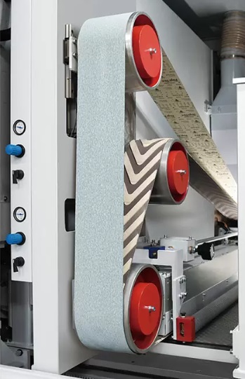 Motimac WT TRHG 1300  Узел поперечного шлифования с сегментированным утюжком и шевронной лентой «Т»  Электронный утюжок с 80-ю управляемыми сегментами, шириной 16 мм каждый  Информация на каждый сегмент передается от высокочувствительного электрон...